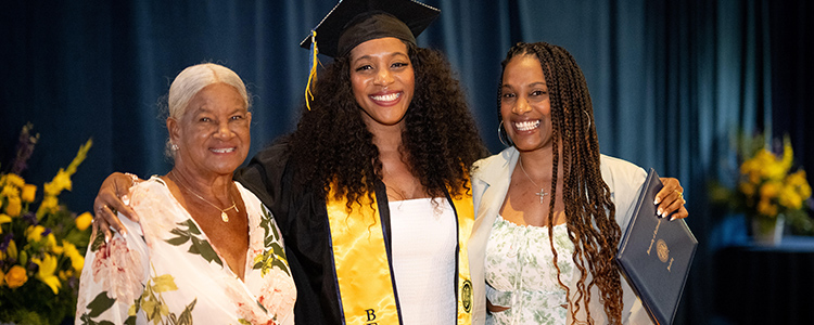 First generation student and chemical engineer Kayanna Harris and family.