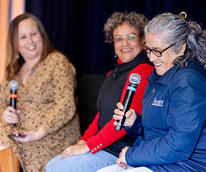 Staff speaking on stage